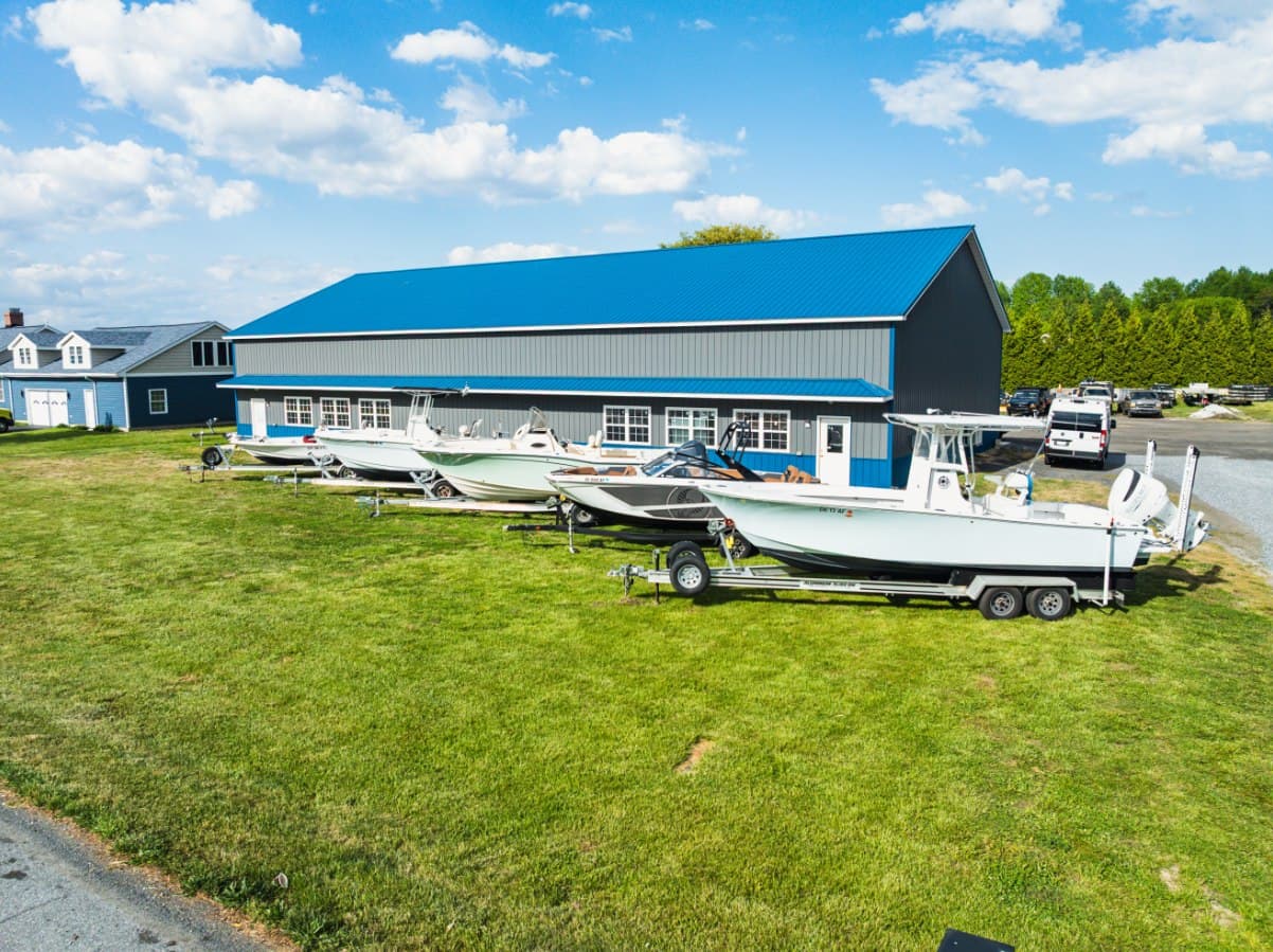 Delmarva Service Center's marine repair facility at 18473 Harbeson Rd, Milton, DE 19968 — boats staged outside the shop